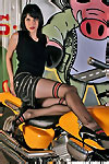 Beauty pantyhose lady posing on motorbike